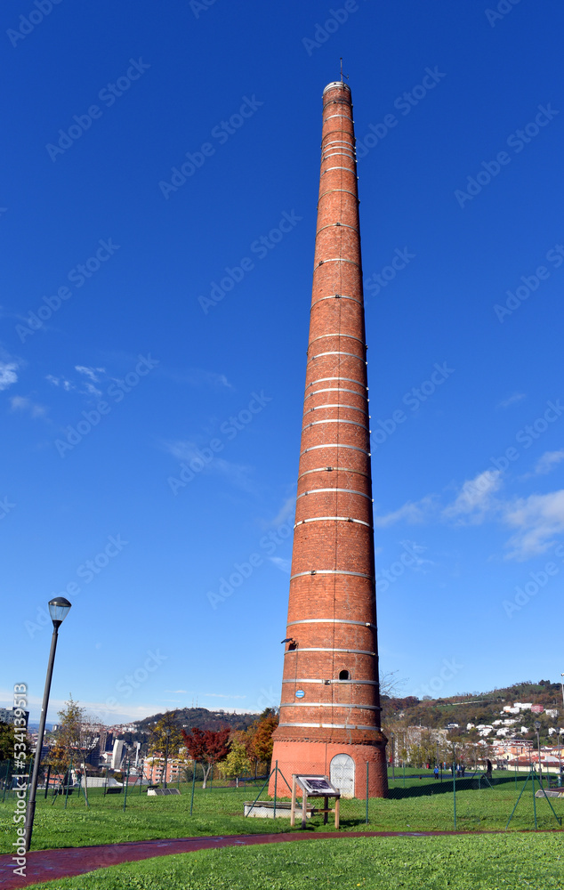Chimney of the old Etxebarria Factory in the Etxebarria Park. Bilbao. Basque Country. Spain