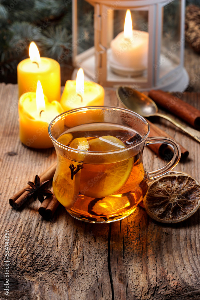 A cup of hot tea among Christmas decorations. Cozy atmosphere. A cup of hot tea among Christmas decorations. Cozy atmosphere.