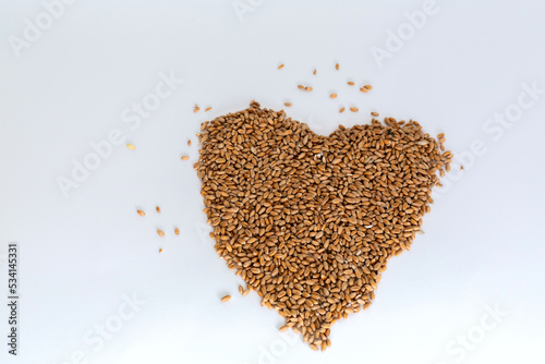 Grains wheat heart shape. White background.