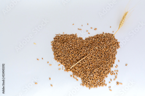 Grains wheat heart shape. White background.