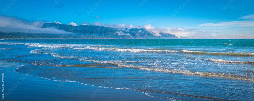 Seascape with waves rolling in on Crescent Beach near Del Norte Coast Redwood State Park in Crescent City, California