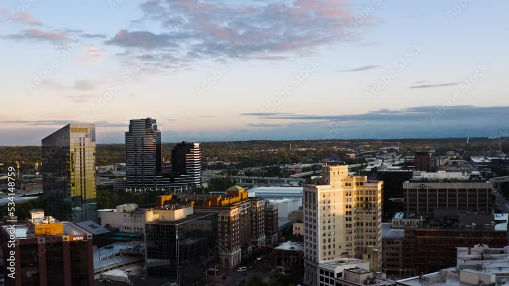 4K Drone zoom out shot during sunrise in Grand Rapids, Michigan with beautiful colors against the buildings 4K Drone zoom out shot during sunrise in Grand Rapids, Michigan with beautiful colors against the buildings