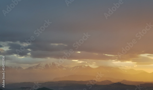 hdr Un mare di luce inonda le montagne fra la nebbia al tramonto © GjGj