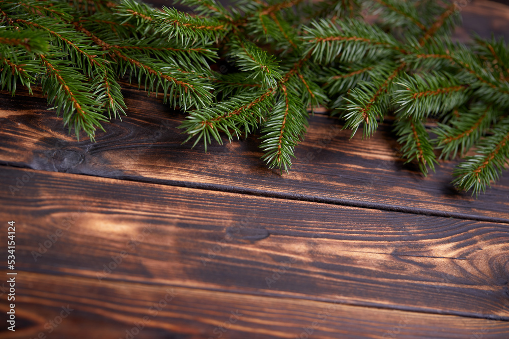 Christmas tree branches on the wooden background Christmas tree branches on the wooden background