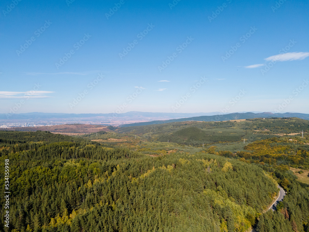 Aerial landscape with green mountains and blue sky