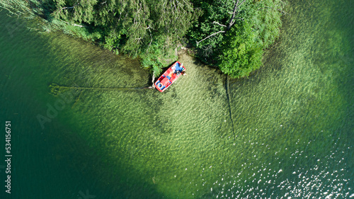 Water bicycle at the lake, islands. Drone aerial view.