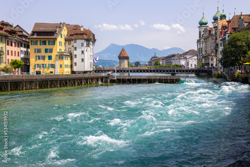 LUCERNE, SWITZERLAND, JUNE 21, 2022 - The rushing waters of the Reuss River in the center of Lucerne, Switzerland