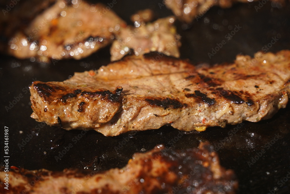 Roasting different pieces of beef for burgers and quesadillas. Roasting different pieces of beef for burgers and quesadillas.