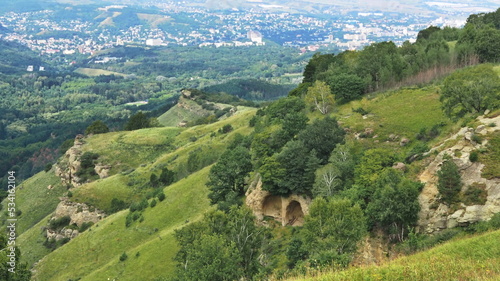 Panoramic views from Bolshoye Sedlo mountain to the Kislovodsk National Park and the city of Kislovodsk, North Caucasus, Russia. photo