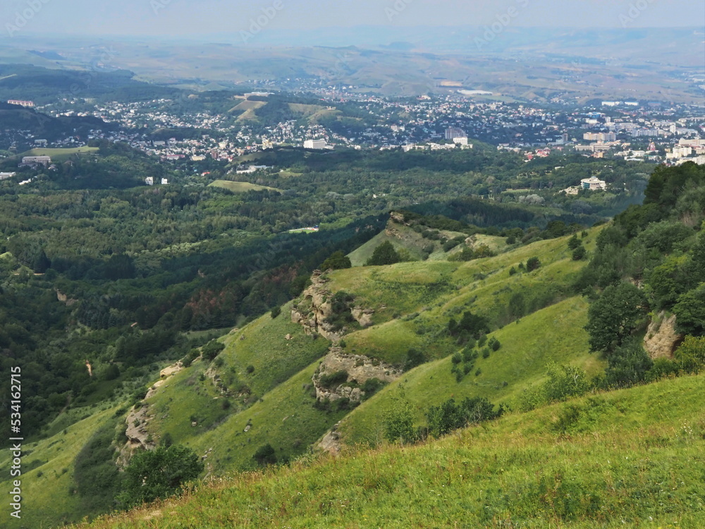 Panoramic views from Bolshoye Sedlo mountain to the Kislovodsk National Park and the city of Kislovodsk, North Caucasus, Russia.