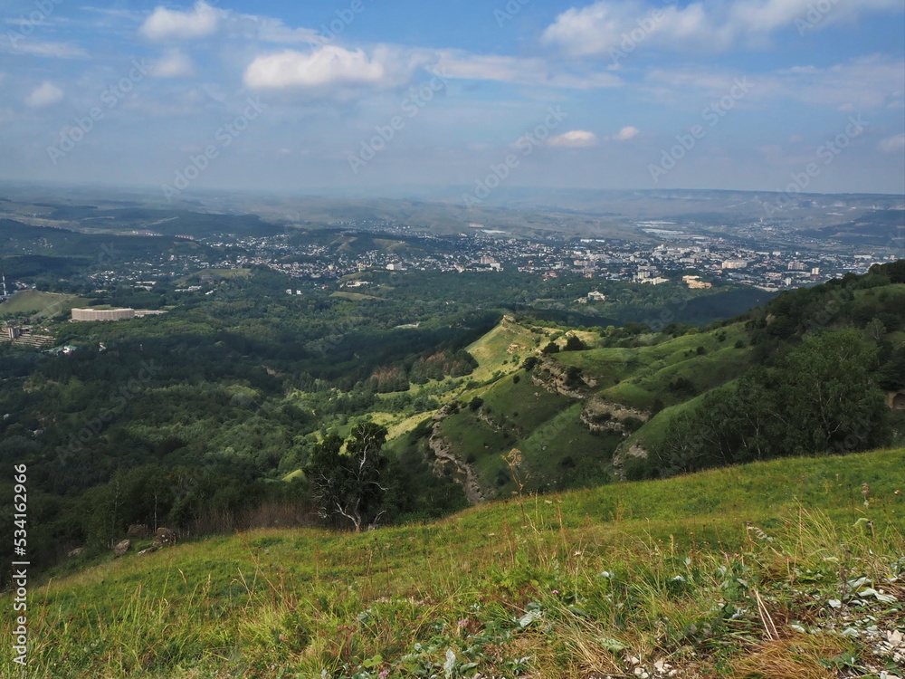 Panoramic views from Bolshoye Sedlo mountain to the Kislovodsk National Park and the city of Kislovodsk, North Caucasus, Russia.