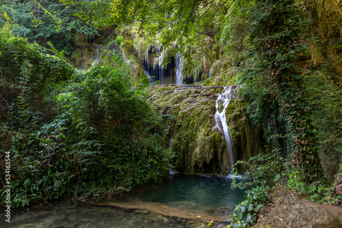 Krushunski waterfalls with turqoize waters and beautiful ecosystem photo