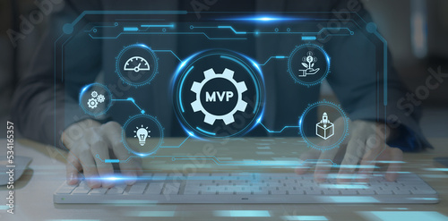 MVP, minimum viable product concept for lean startup. New product release planning. Analysis and market validation. Working on computer with  MVP and learn, build, measure icons on smart background.