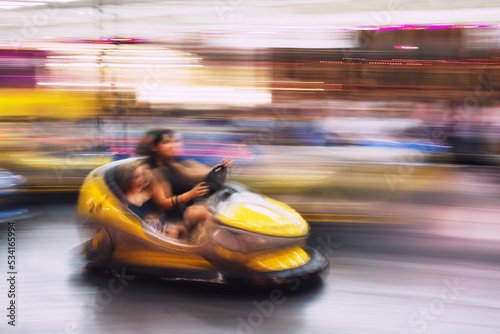Abstract photo of bumper cars at amusement park of izmir fun fair.