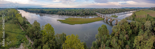 Tableau sur toile View of a bridge over the river Po in Piedmont in the drought summer of 2022 at
