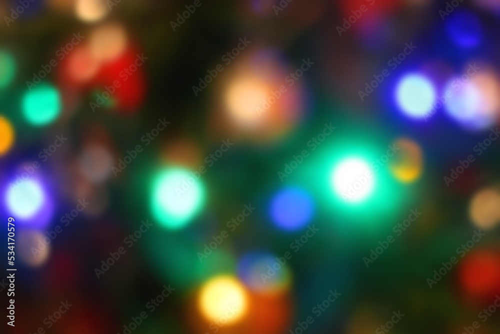 Defocused colorful Christmas lights. Festive Christmas background, copy space.