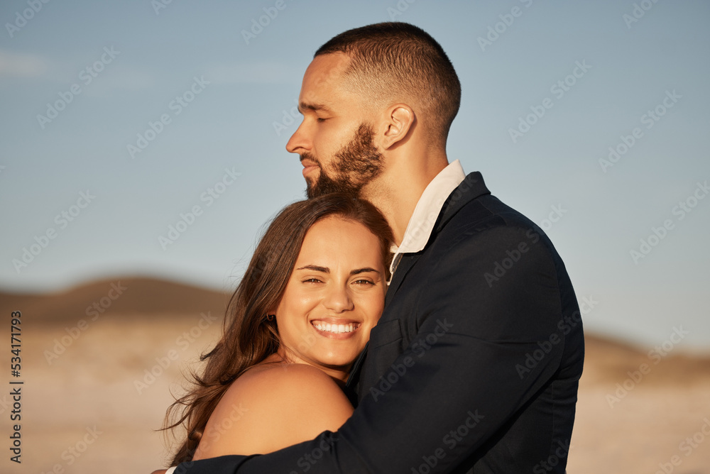 Wedding, love and happy with couple at sunset and hug together for celebration, event or beach venue. Smile, support and commitment with man and woman holding in embrace for marriage, goals and trust Wedding, love and happy with couple at sunset and hug together for celebration, event or beach venue. Smile, support and commitment with man and woman holding in embrace for marriage, goals and trust