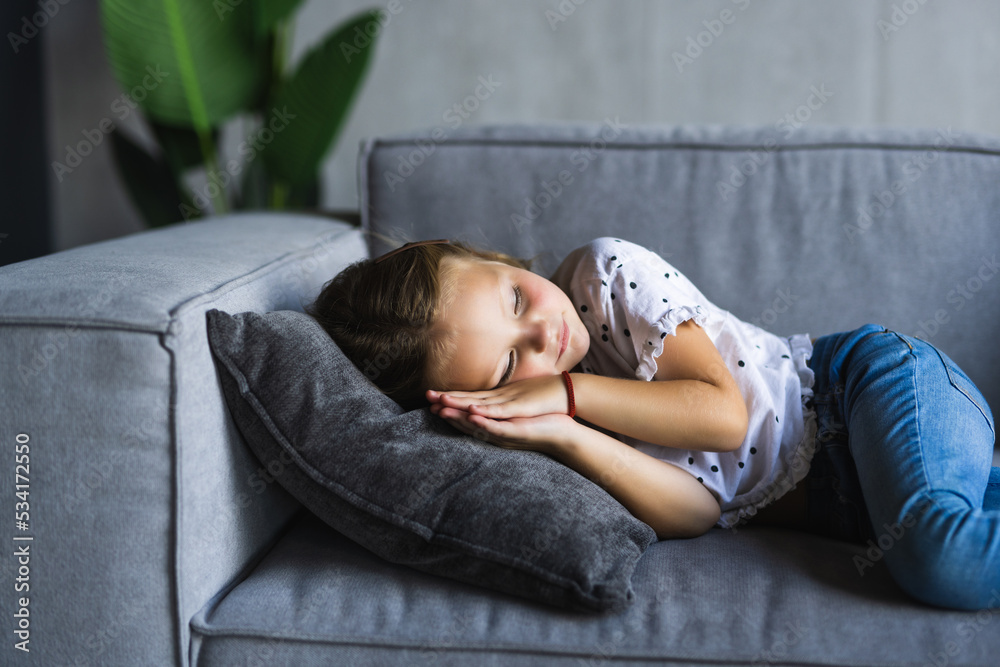 Close up little girl taking day nap, sleeping on cozy comfortable couch at home, cute adorable kid child with closed eyes lying resting on sofa, enjoying healthy sleep, falling asleep alone Close up little girl taking day nap, sleeping on cozy comfortable couch at home, cute adorable kid child with closed eyes lying resting on sofa, enjoying healthy sleep, falling asleep alone