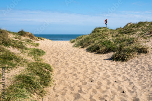 Warkworth Beach viewed through the sand dunes, Warkworth, Northumberland, England, United Kingdom, Europe photo