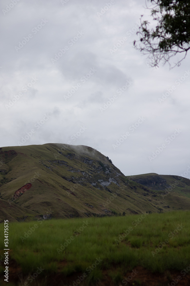 madagascar in a wild landscape with mountains and hills and clouds green grass madagascar in a wild landscape with mountains and hills and clouds green grass