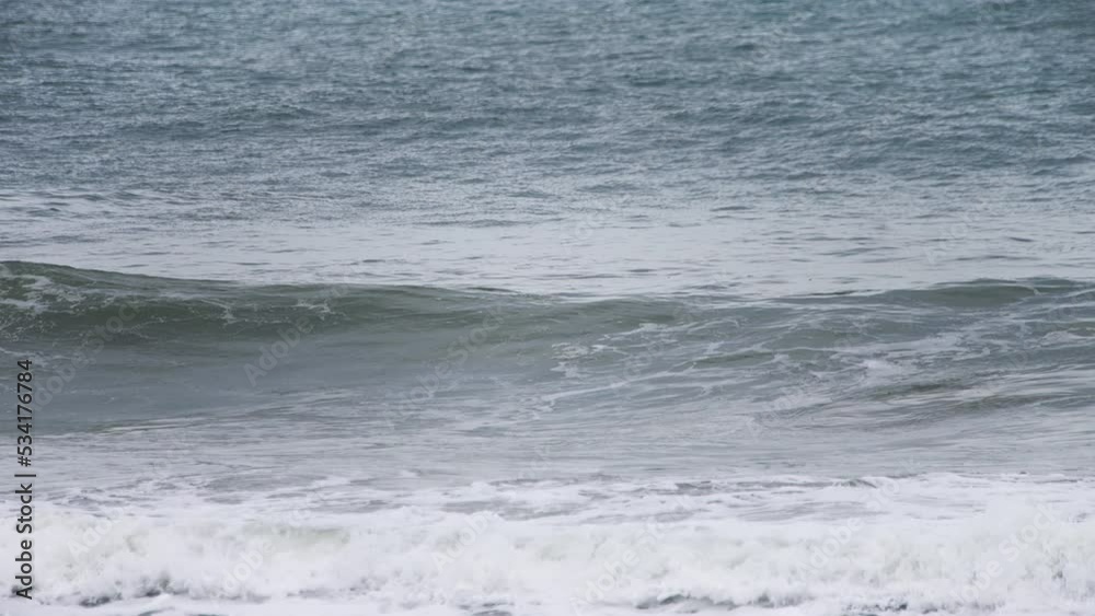Swell wave forming in slow motion in the shore with a deep dark blue ocean behind it and white water spilling in high speed camera 120fps 4K footage. Swell wave forming in slow motion in the shore with a deep dark blue ocean behind it and white water spilling in high speed camera 120fps 4K footage.