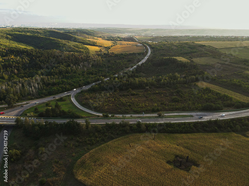 landscape drone picture moldova chisinau sunset sun clouds blue hour road forest farmland