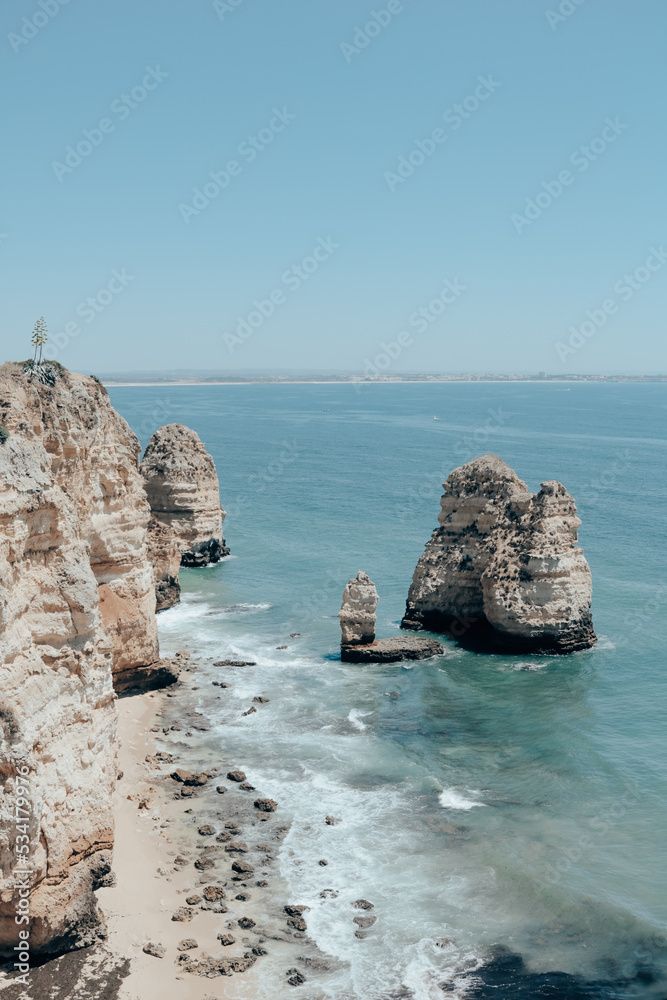 rocky rock cost on the ocean portugal summer beach vacation with sun 