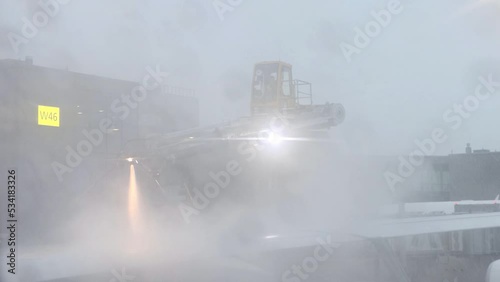A aircraft de-icing (anti-icing) using modern de-icing technology with the hydraulics facility photo