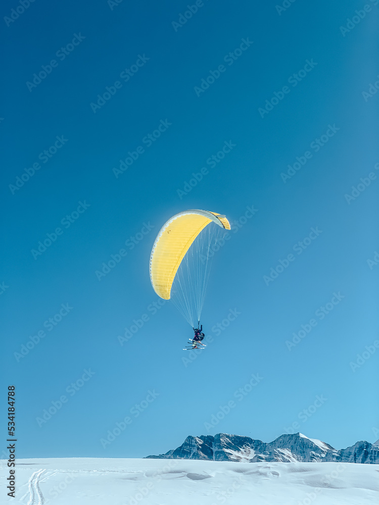 parachute parapenter flying mountains blue yellow parachute parapenter flying mountains blue yellow