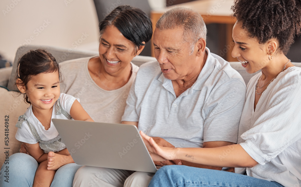 Family, laptop and child watching educational video, movie or cartoon sitting with parent and grandparents on a sofa in their brazil home. Bonding, fun and internet streaming with man, women and kid Family, laptop and child watching educational video, movie or cartoon sitting with parent and grandparents on a sofa in their brazil home. Bonding, fun and internet streaming with man, women and kid