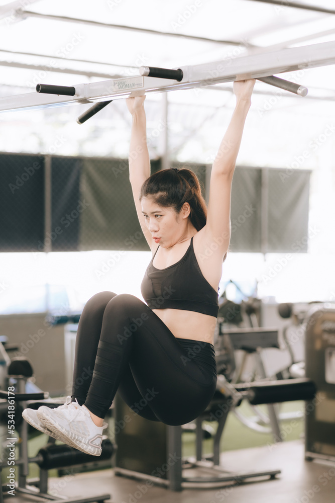 Asian female fitness athlete in gym Asian female fitness athlete in gym