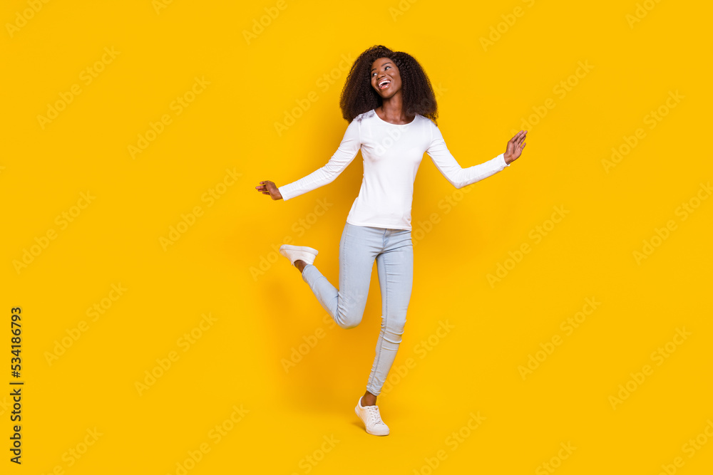 Full body photo of overjoyed positive lady enjoy dancing clubbing have good mood isolated on yellow color background
