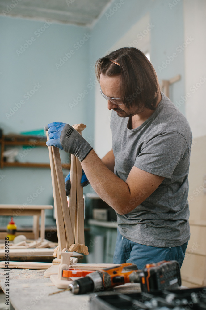 A carpenter makes wooden toys in a carpentry Making a bed