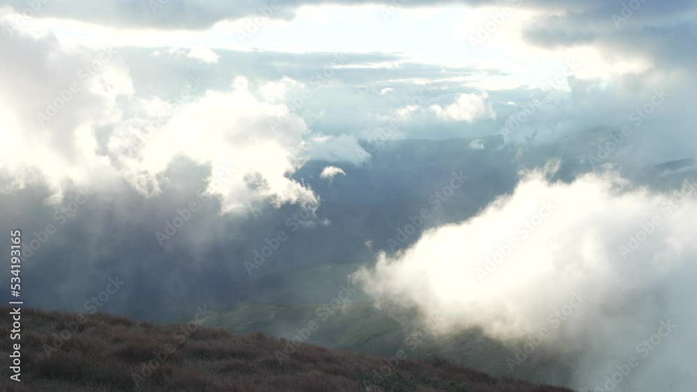 Background video of silhouettes of mountain ranges and the sun breaking through the clouds. Mystical beautiful landscape of nature. High quality 4k footage Background video of silhouettes of mountain ranges and the sun breaking through the clouds. Mystical beautiful landscape of nature. High quality 4k footage