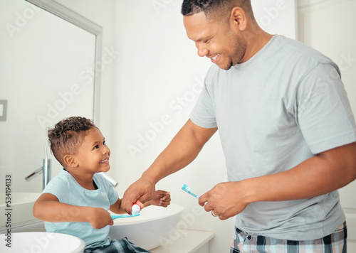 Dental  father and child brushing teeth with a toothbrush in a bathroom for healthy  wellness and oral care together. Happy young kid  boy and son showing dad a big smile for morning hygiene routine