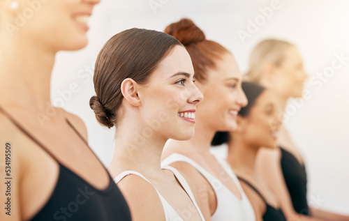 Ballet, audition and women in dance academy studio with smile, motivation and vision for art performance. German ballerina girl dancer with group or team feeling proud after dancing together photo