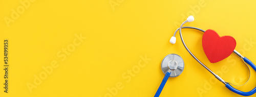 Blue stethoscope with red heart, medical care design concept.