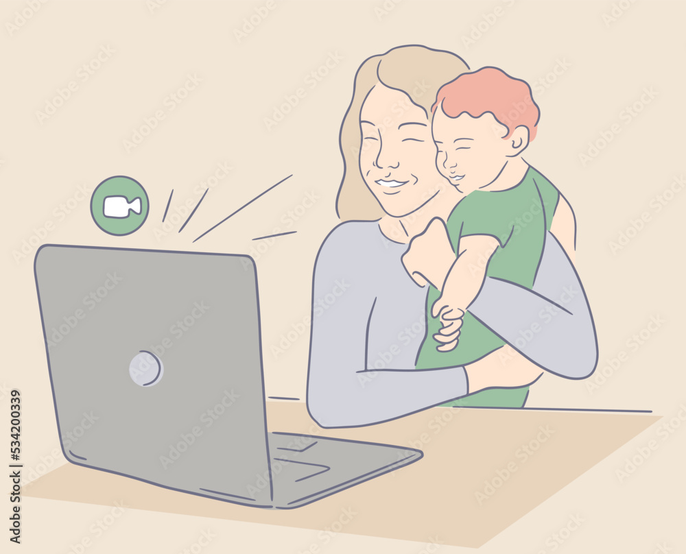 Smiling mother holding baby and doing FaceTime. A woman sits at a table and makes a video call using a home laptop. Mom shows her little baby during an online meeting Smiling mother holding baby and doing FaceTime. A woman sits at a table and makes a video call using a home laptop. Mom shows her little baby during an online meeting