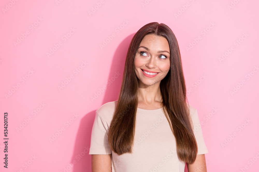 Portrait photo of young cute girlish woman long brown hair toothy smile look dreamy curious information sale isolated on pastel pink color background Portrait photo of young cute girlish woman long brown hair toothy smile look dreamy curious information sale isolated on pastel pink color background