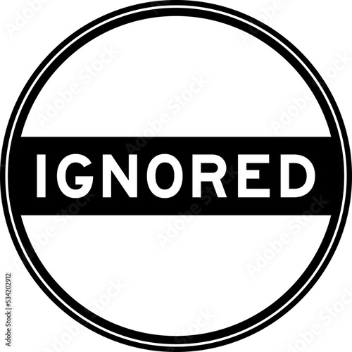 Black color round seal sticker in word ignored on white background