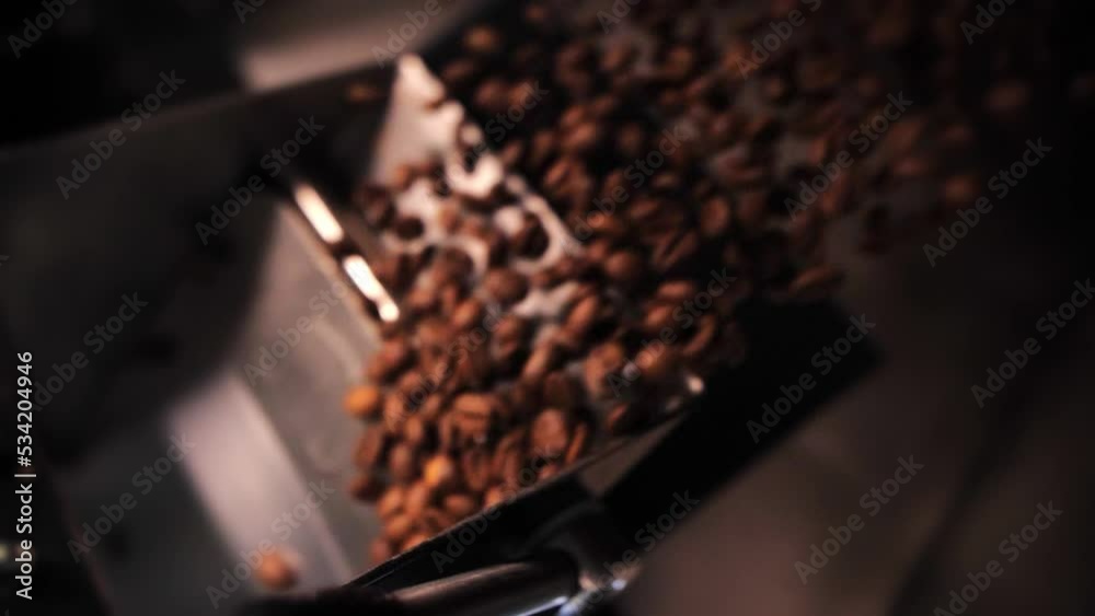 Coffee roaster machine mixing aroma beans.Preparation fresh aroma