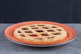 Delicious berry pie on red plate