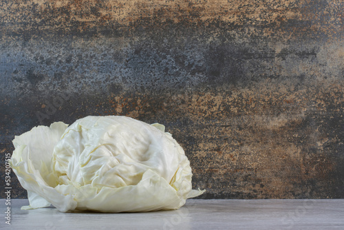 Fresh white cabbage on stone table