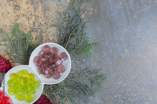 Colorful fruit jelly candies with Christmas pinecones