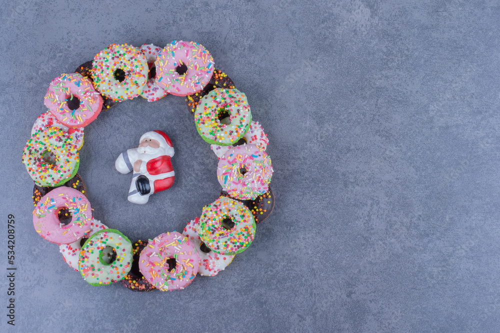 Colorful sweet fresh donuts on a gray background Colorful sweet fresh donuts on a gray background