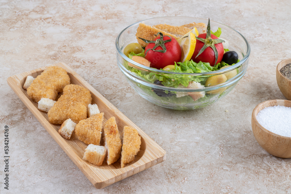 Caesar salad with lettuce, chopped chicken meat and cherry tomatoes Caesar salad with lettuce, chopped chicken meat and cherry tomatoes