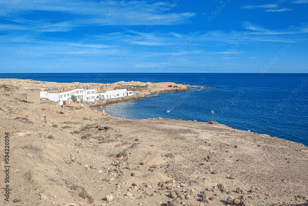 View of the sea coast with buildings. Bay in the sea. Sand. View of the sea coast with buildings. Bay in the sea. Sand.