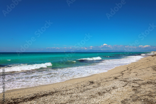 Waves in ionian sea in greece - blue water, white sand