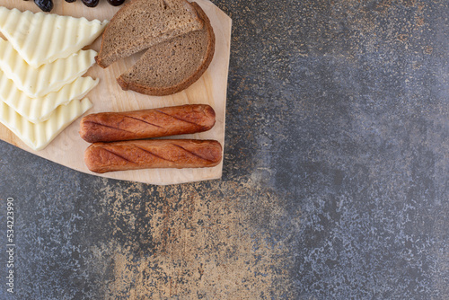 Snack paltter with bread slices, sausage and cheese photo