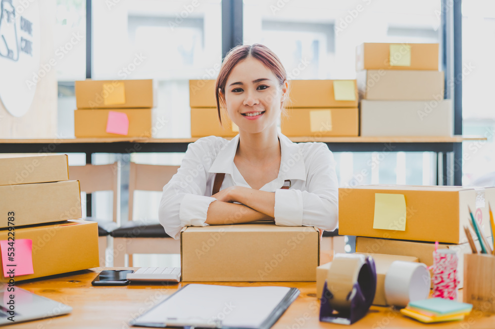 Small business owners online are smiling. and happy to work at a parcel delivery business offering orders and products to its customers online retailer - online shopping. Small business owners online are smiling. and happy to work at a parcel delivery business offering orders and products to its customers online retailer - online shopping.